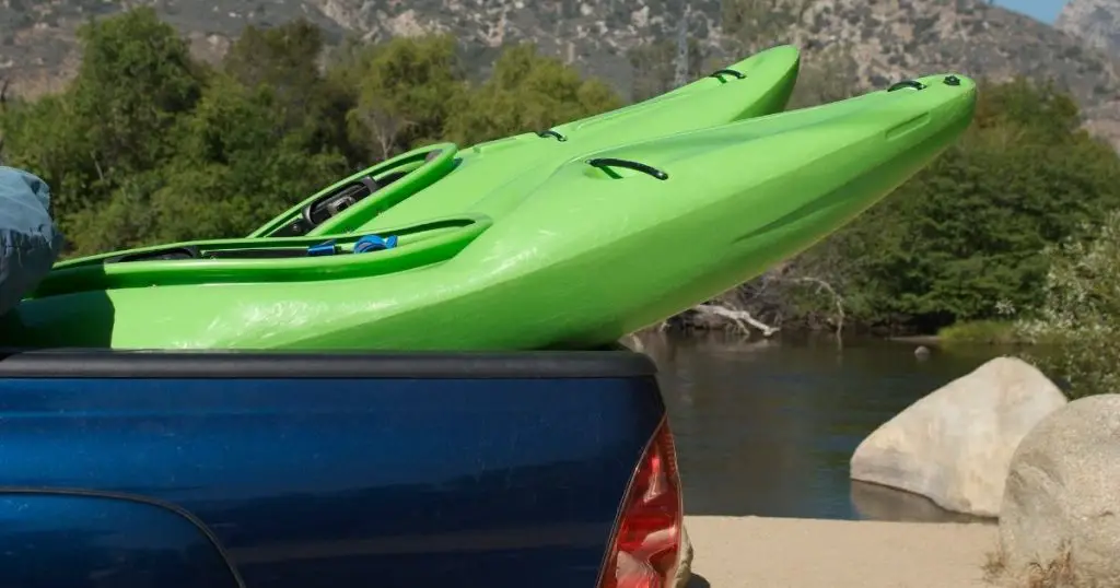 How far can a kayak hang out of a truck?