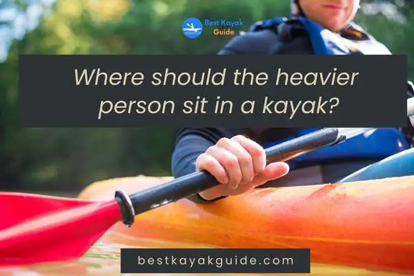 Where should the heavier person sit in a kayak?